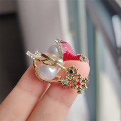 Snowman brooch displayed on sweater