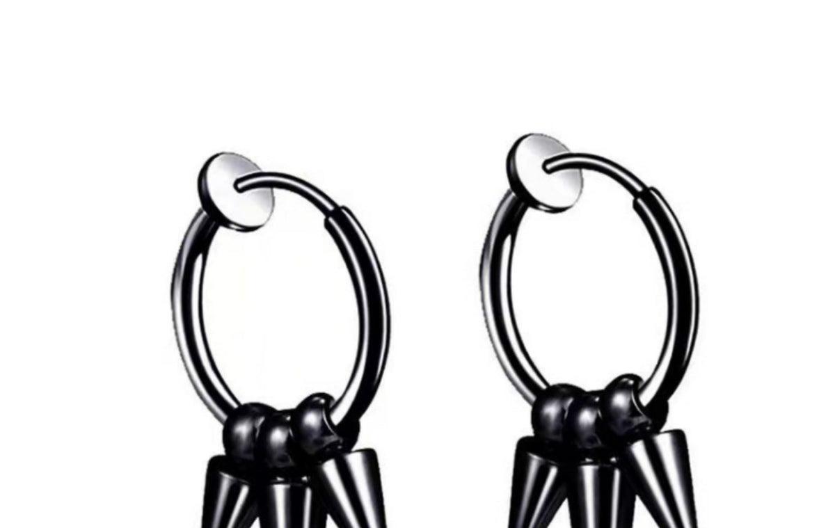 close up of titanium pointed studs earrings