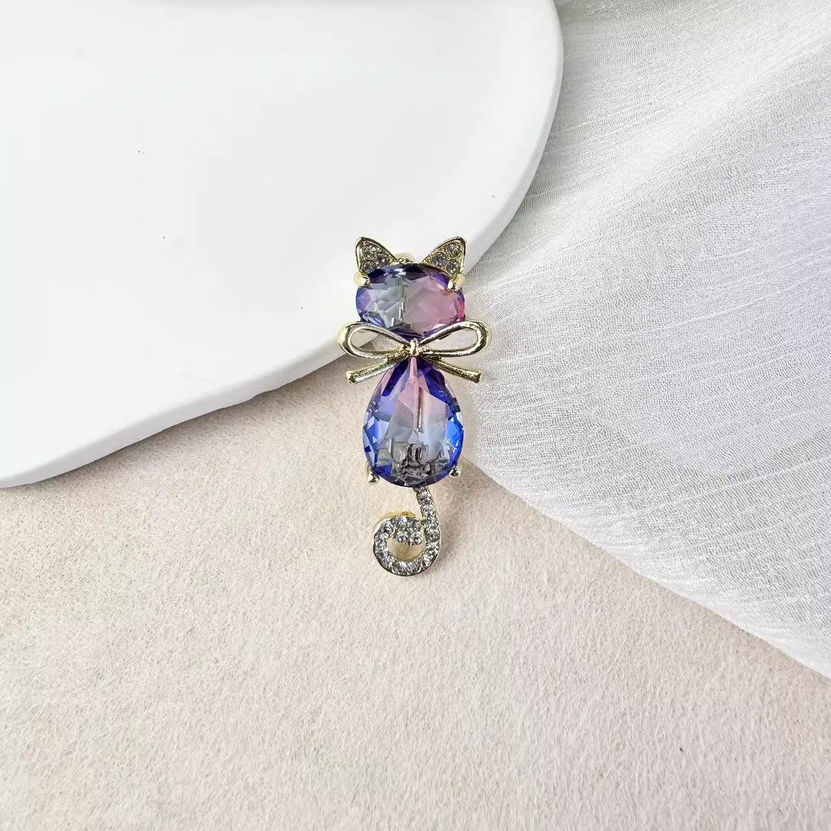 Electroplated cat pin with vibrant colours